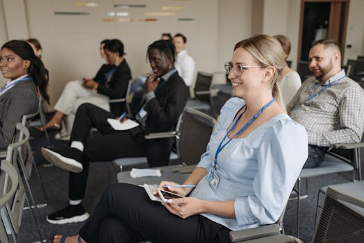 Participants attentively engage in a seminar, showcasing diversity and collaboration.